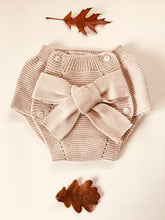 Adorable baby bloomers with a big bow, knitted in beige colour with 100% of the softest cotton.