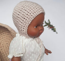This cosy bonnet is hand knitted in Europe, specially designed for the 34 cm dolls, but can fit dolls around 32 - 38 cm (12 - 15 inch) Miniland, Minikane, Paola Reina Gordis and similar.