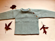 Sweet Unisex knitted Jumper with wooden buttons on the side in an adorable light green colour. I must have basic piece! 