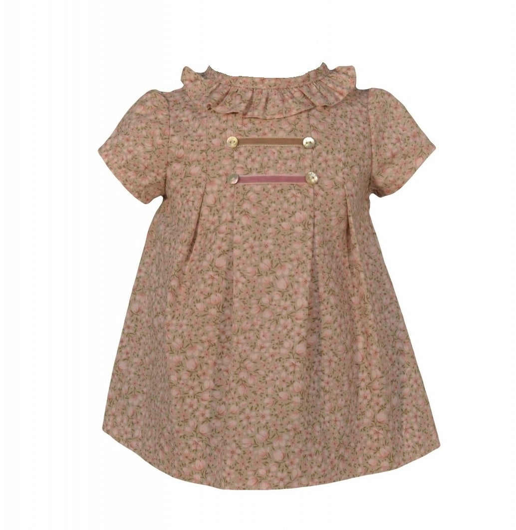 This beautiful dress is made of a beautiful cotton fabric in light pink pattern that resembles tulips. With a sweet round collar, it is also finished off with a delicate frill panel all around the neckline and shoulders.