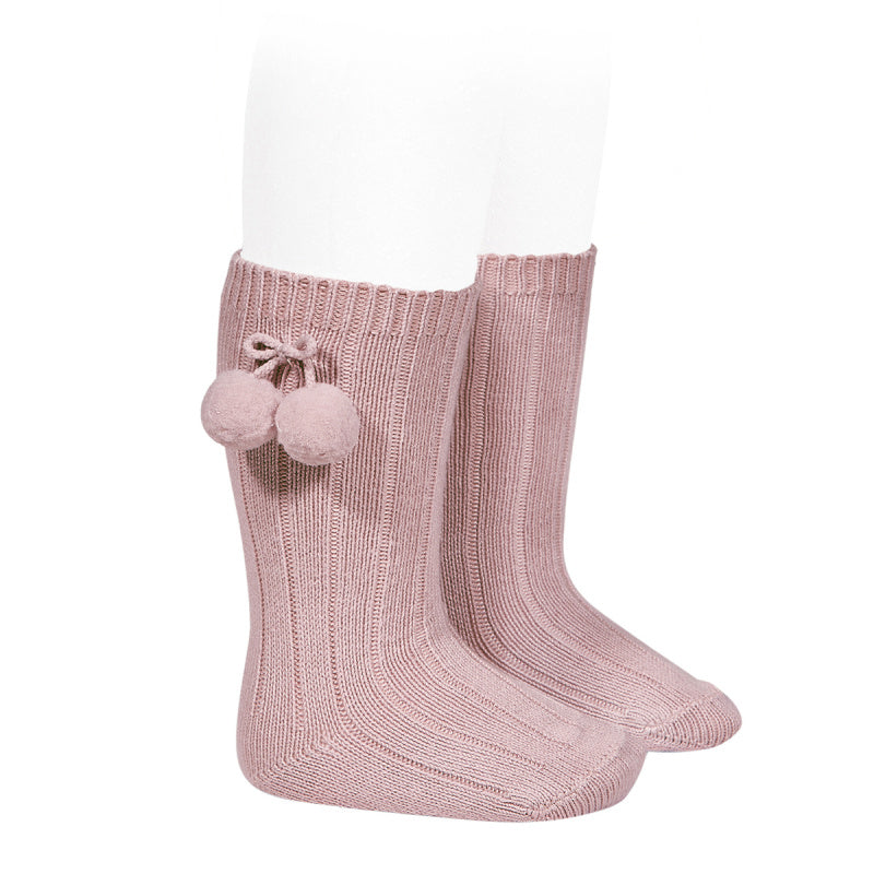 Beautiful and elegant Knee High Ribbed socks with Pom-Poms. An stunning addition to your little one's outfit! Fun and elegant. condor